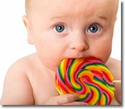 Baby eating a lollipop